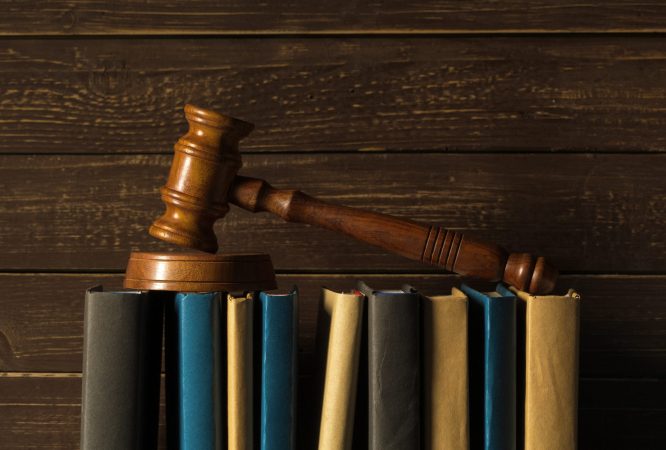 Law students studying legal principles and case analysis for the OTHM Level 5 Extended Diploma in Law in a professional academic environment.